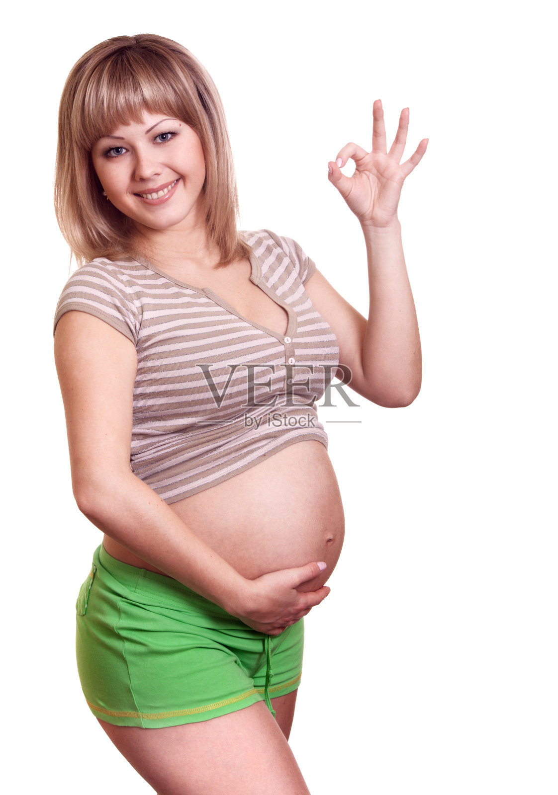 快乐的孕妇表现出ok的迹象照片摄影图片