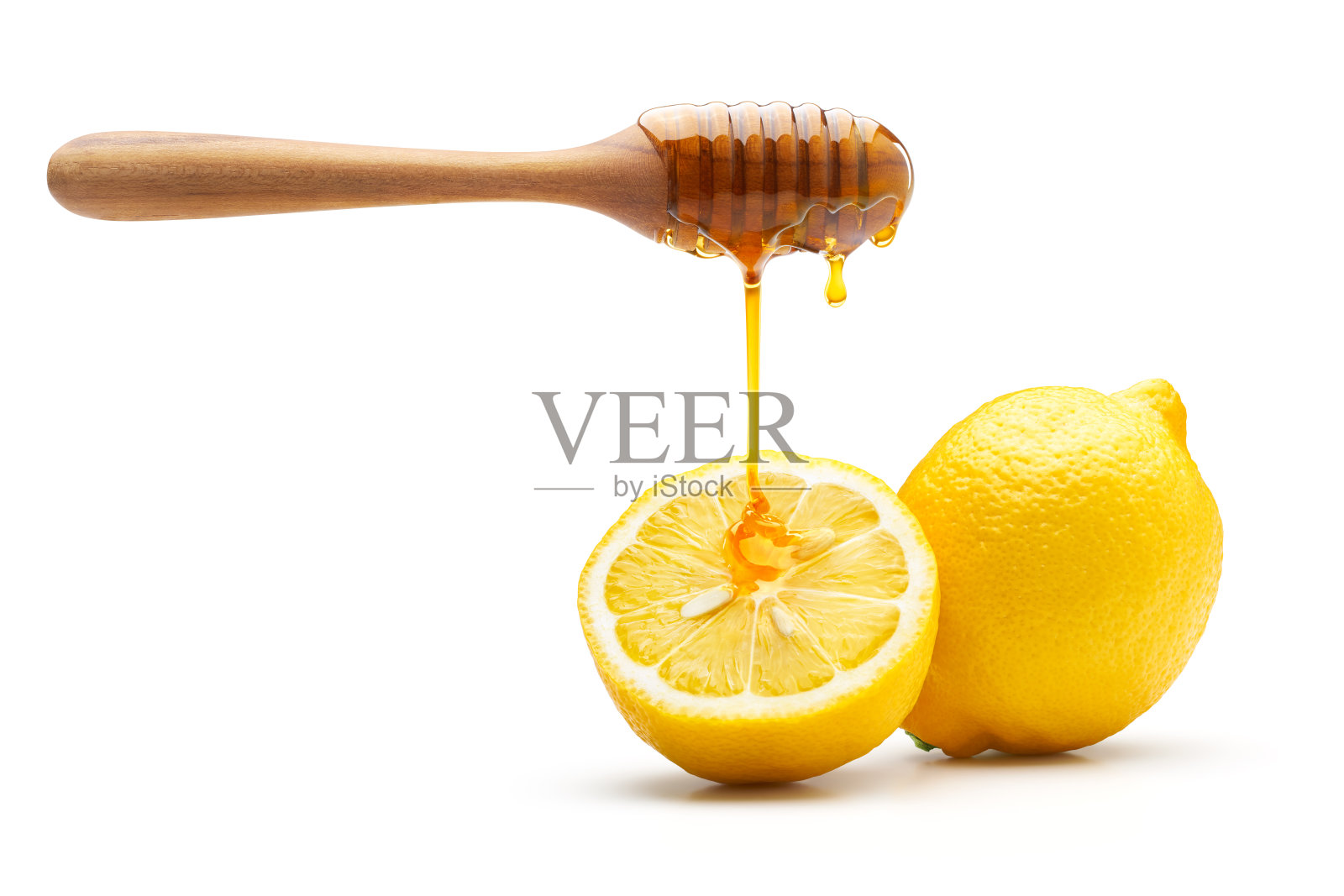 蜂蜜滴在新鲜柠檬分离照片摄影图片