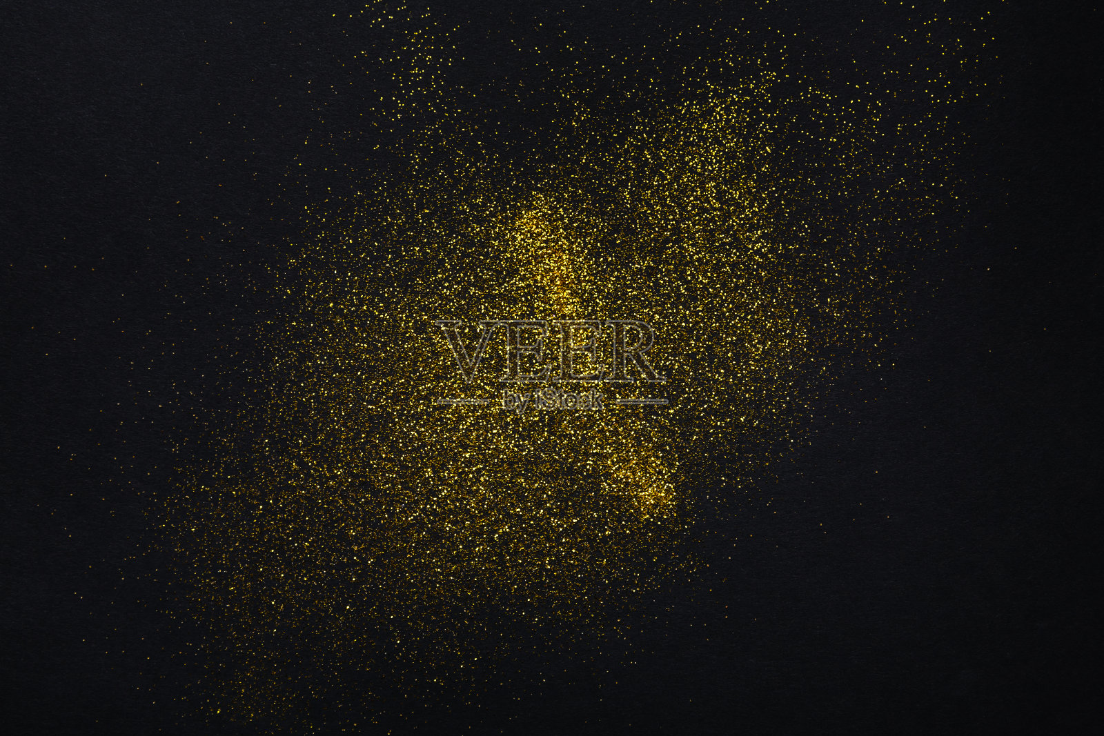 金色闪光的沙子纹理上的黑色，抽象的背景。照片摄影图片
