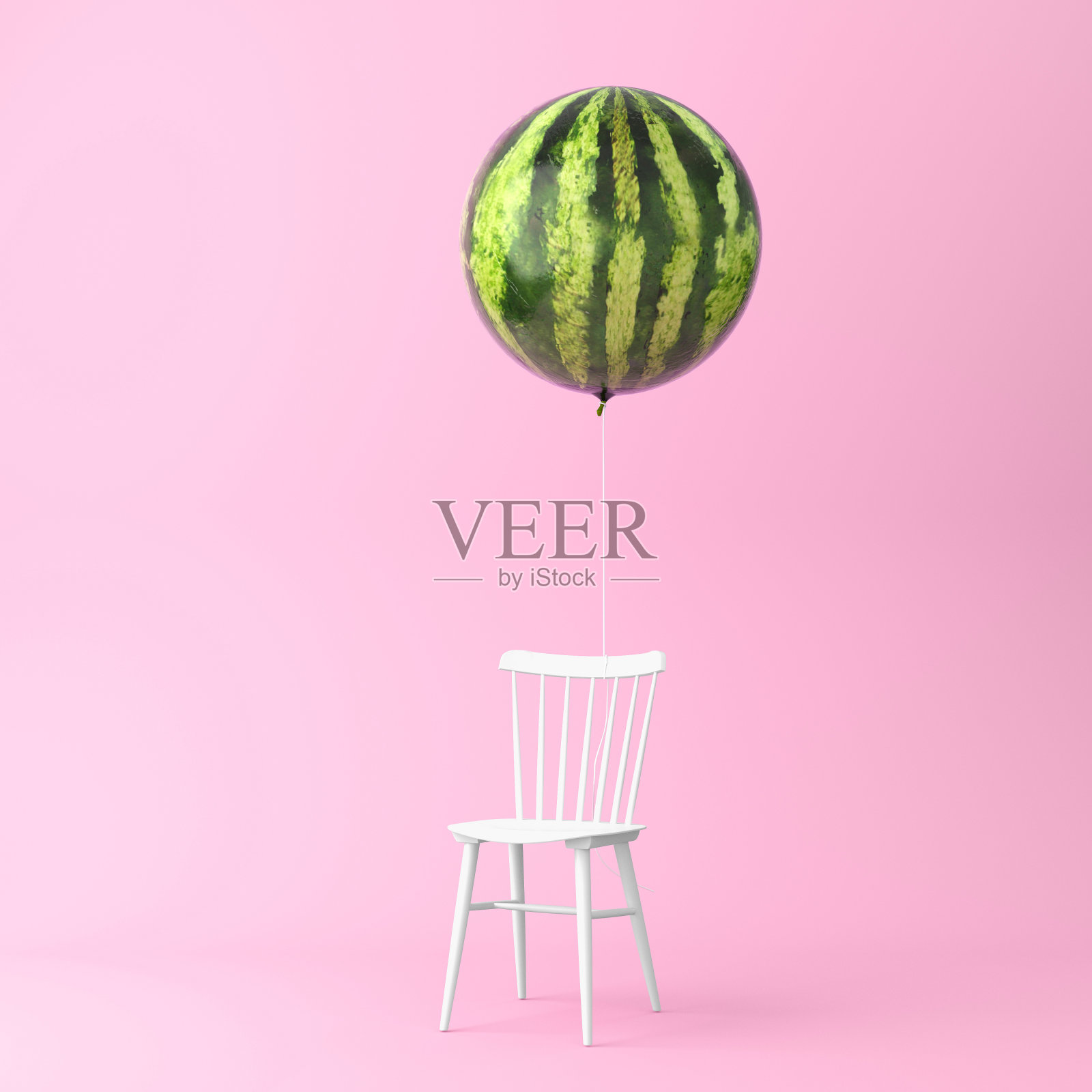 气球西瓜与椅子概念在柔和的粉红色背景。最小的想法食物和水果概念。在广告、营销、传播或艺术品设计中产生作品的创意。照片摄影图片