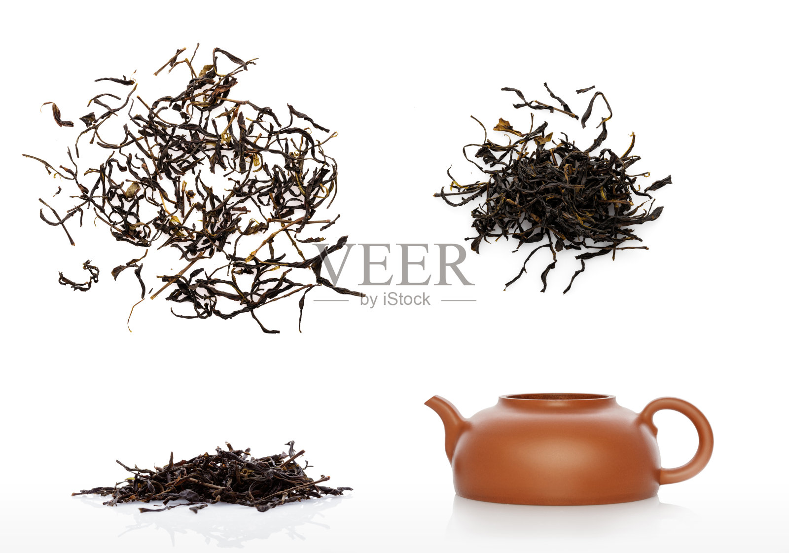 茶壶和中国生茶堆孤立在白色照片摄影图片