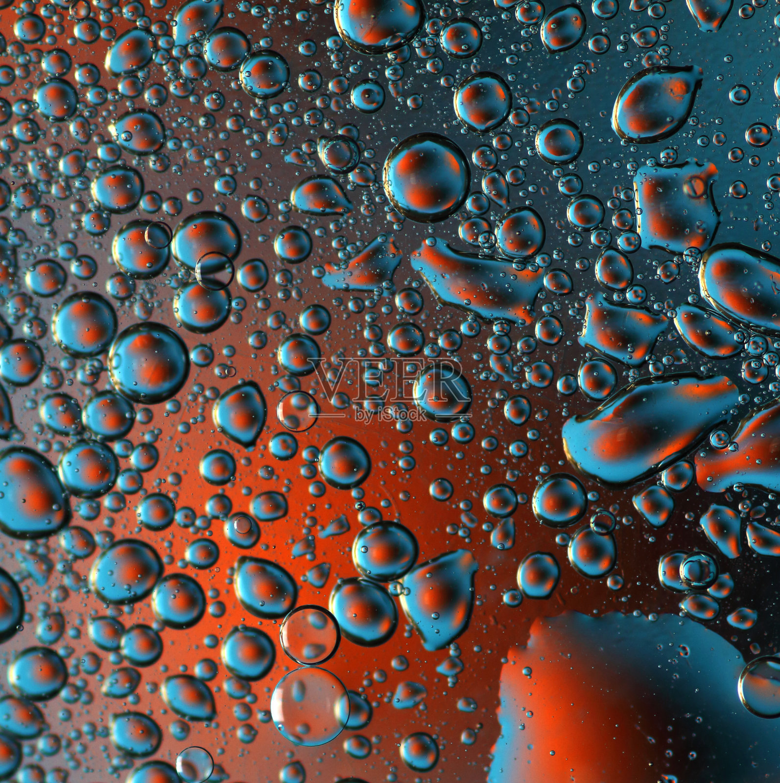 抽象背景——水滴在不同颜色的背景上照片摄影图片