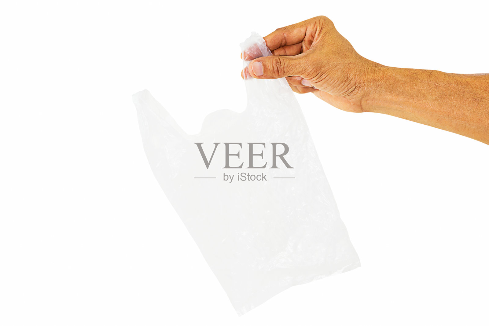 手握空白色透明塑料袋孤立在白色背景与剪切路径照片摄影图片