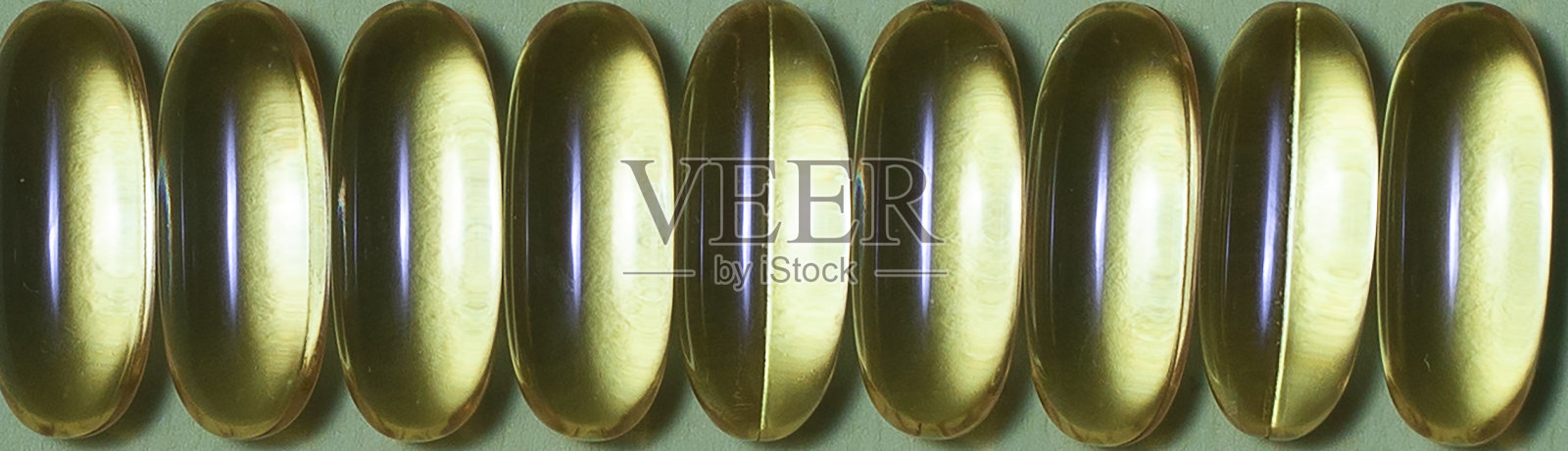 黄色欧米加药片，微距胶囊照片摄影图片