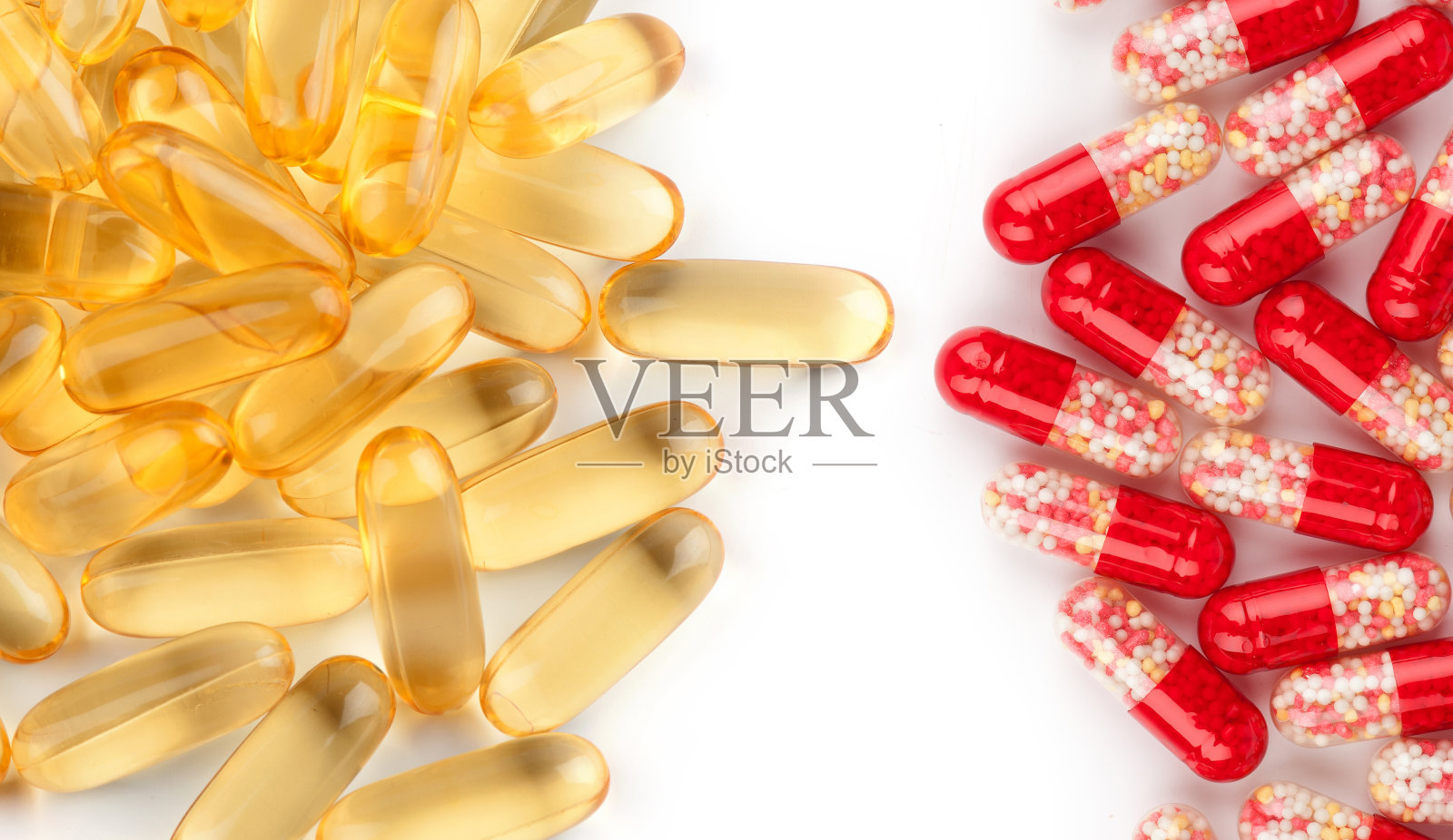 Omega - 3胶囊和红色药片照片摄影图片