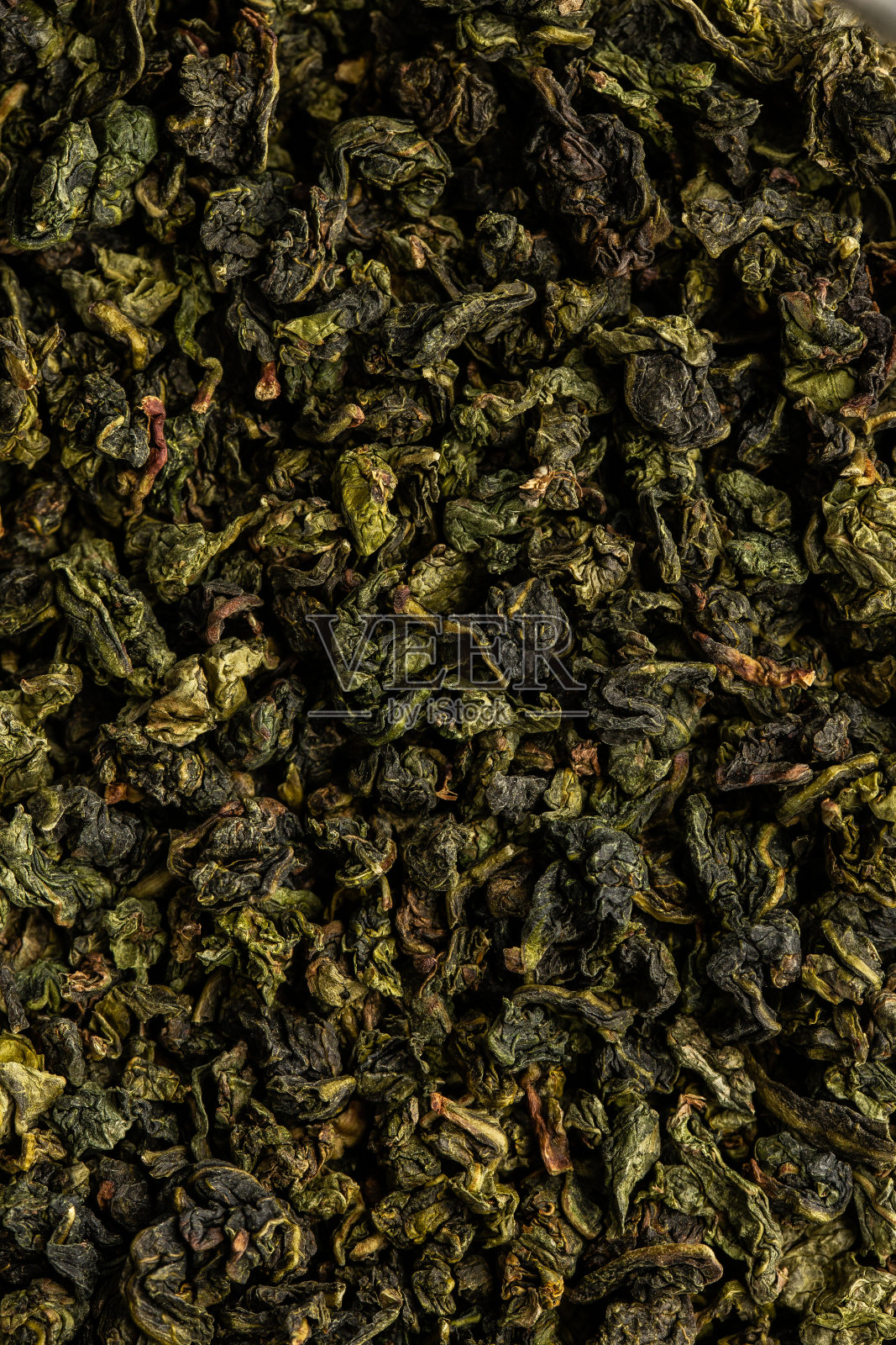 一堆干茶叶。干绿茶。纹理背景的干茶叶芳香照片摄影图片