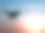 四旋翼飞行器在夕阳的背景下形成剪影素材图片