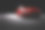 新的红色金属轿车轿车在聚光灯下。现代设计,brandless。素材图片