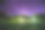 绿树在夜晚星空下的公园树林在紫罗兰色。在夏季，在草地上有闪闪发光的银河星星的景观。从东欧观看春天的季节素材图片