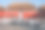 中国北京故宫广场上的鸽子。鸽子在北京紫禁城红墙前飞翔。图中牌匾的中文翻译:午门。素材图片